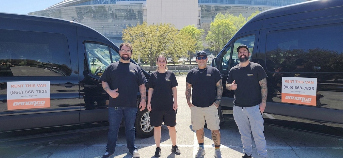 Bandago crew in front of Nashville vans